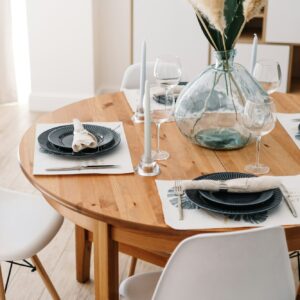 Served dining table in a modern Scandinavian kitchen.