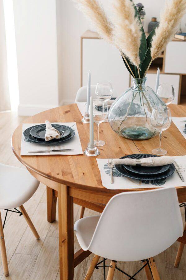 Served dining table in a modern Scandinavian kitchen.